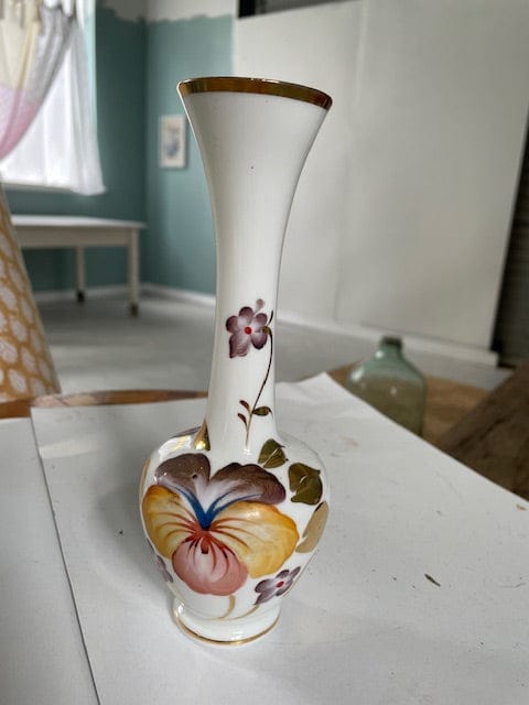 Vintage white vase with flowers