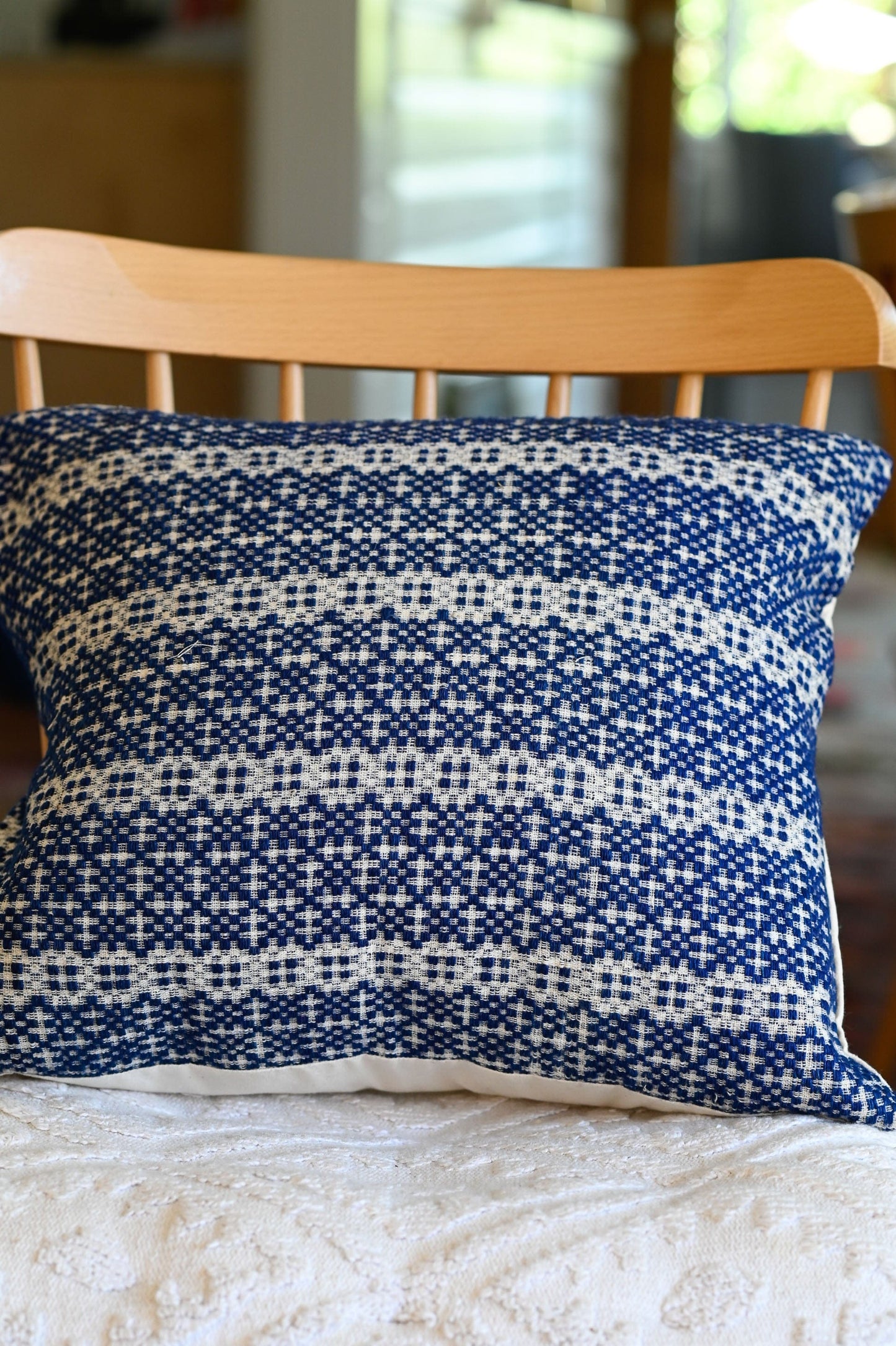 Vintage blue and white woven cushion