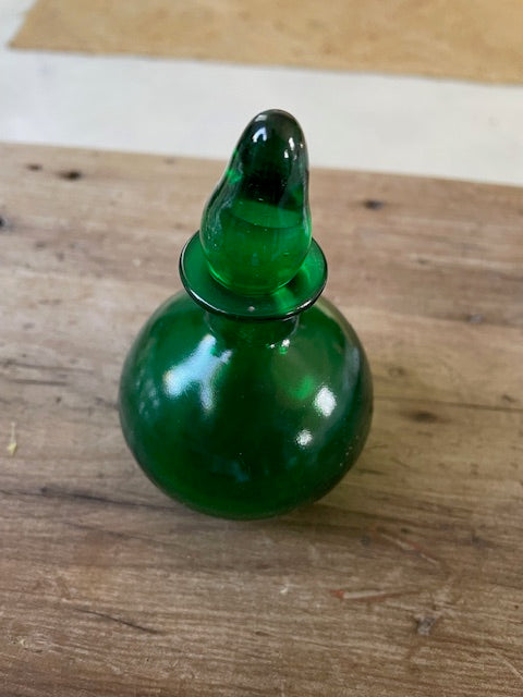 Emerald glass perfume bottle
