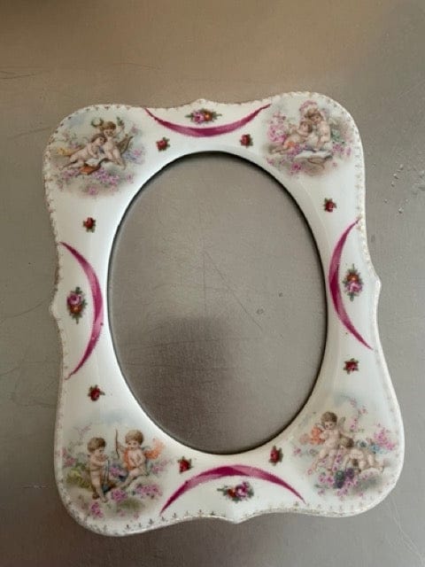 Antique porcelain frame with cherubs