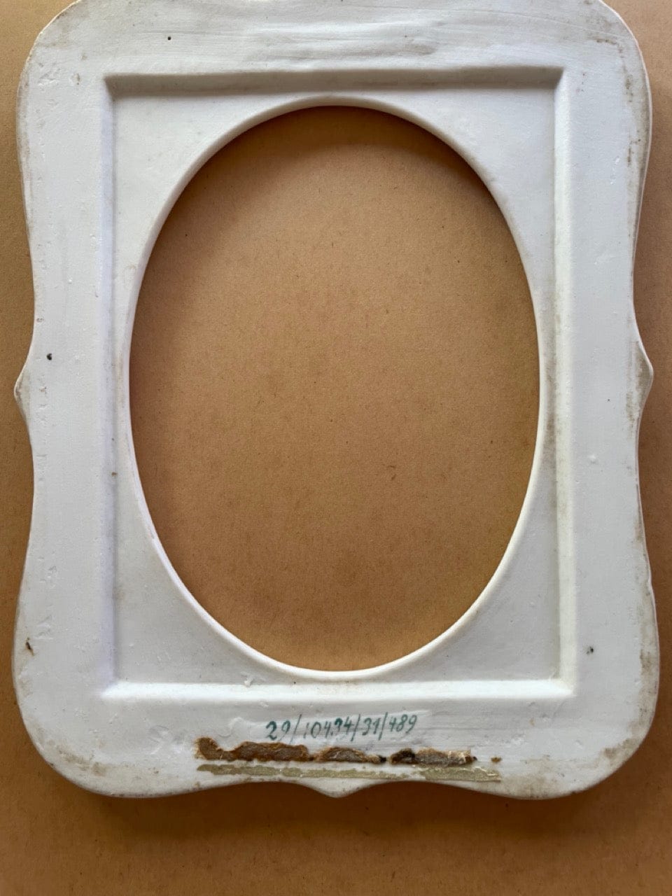 Antique porcelain frame with cherubs