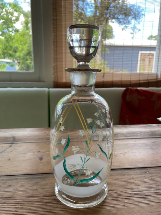 Vintage glass decanter with painted flowers